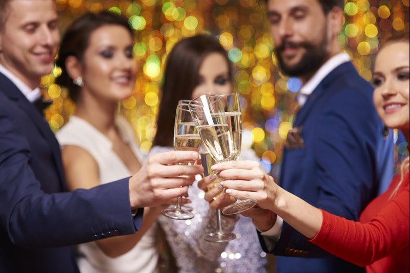Corporate Party Goers clinking champagne glasses