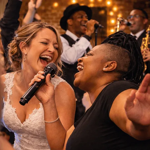 bride singing along with band member